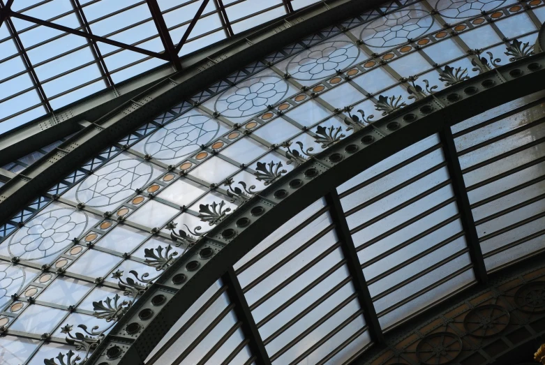 the metal and glass design on top of a building