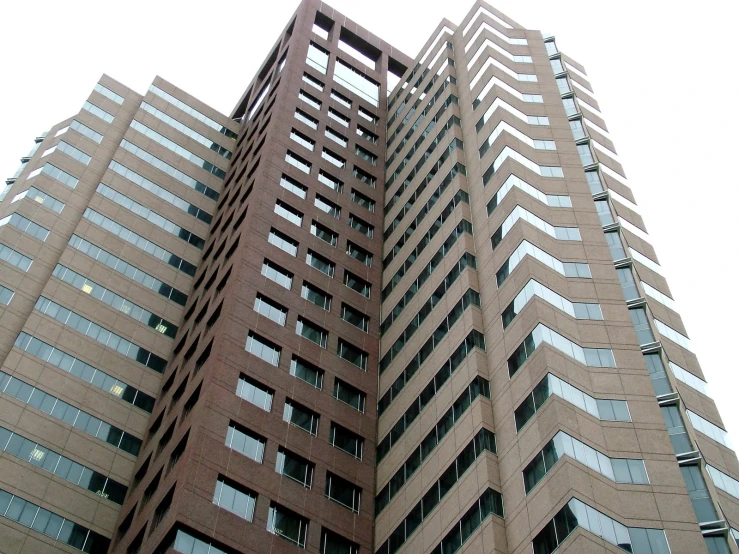 a tall building is shown with the sky in the background