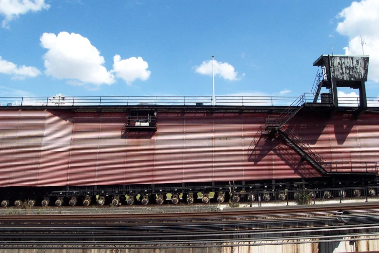 a train car sitting on the tracks in a rail yard