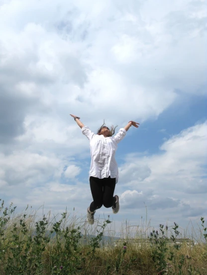 a man is jumping high in the air in the field