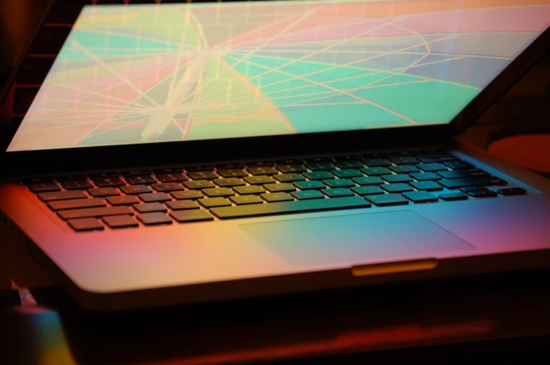 this is a close up picture of a laptop that has a color design on it