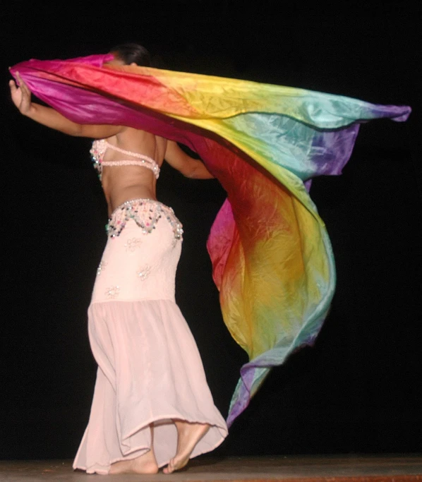 a woman wearing an extremely colorful scarf on her head