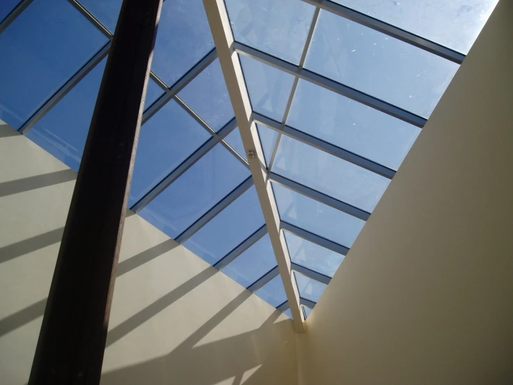 an atrium ceiling that has glass and metal