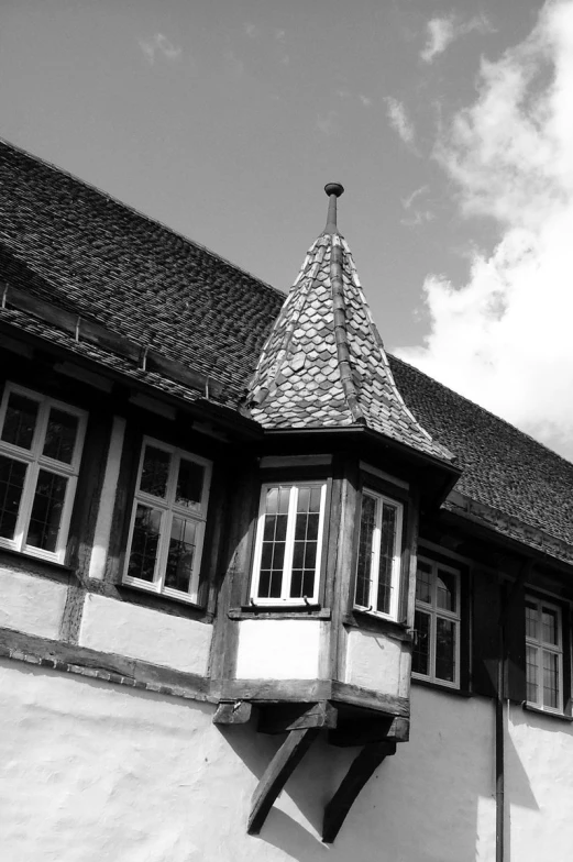 a small house with a clock tower on the side