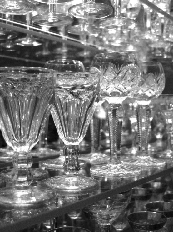 many glass wine glasses sitting on display