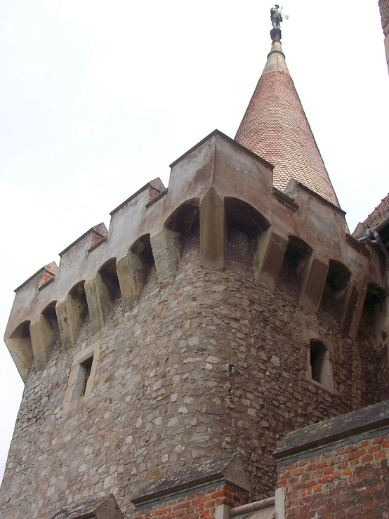 a tower with bricks and a white top