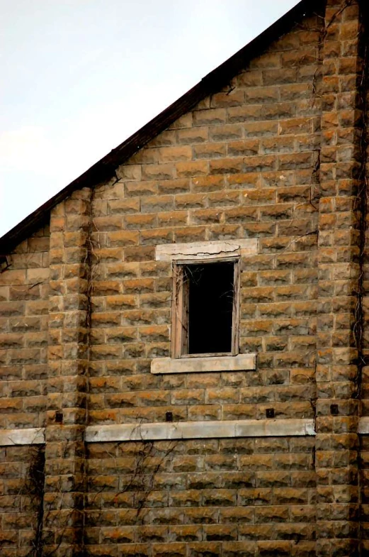 the wall outside of a house made of stone blocks