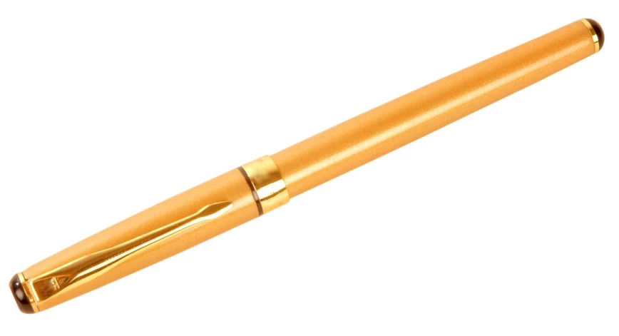 a gold pen on white background