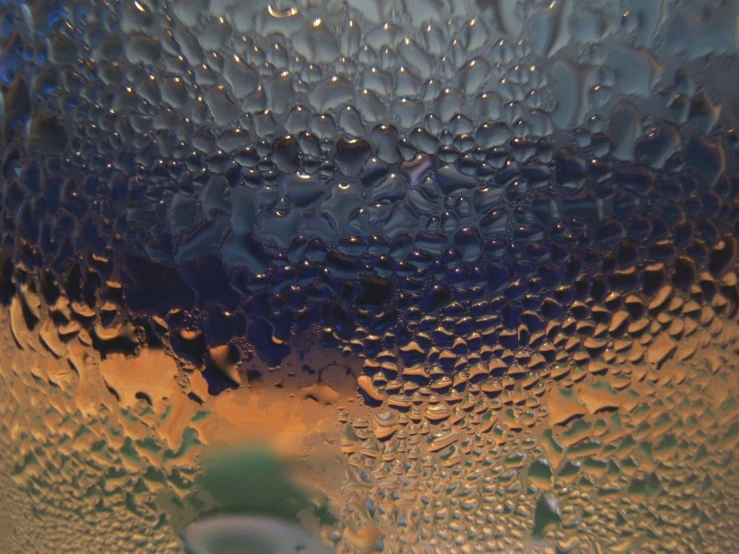 a very close up s of some water on a window pane
