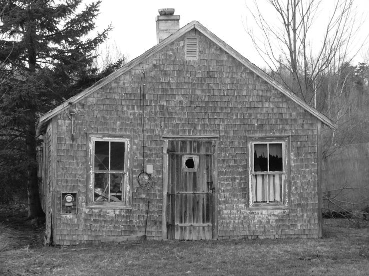 a black and white po of a small house