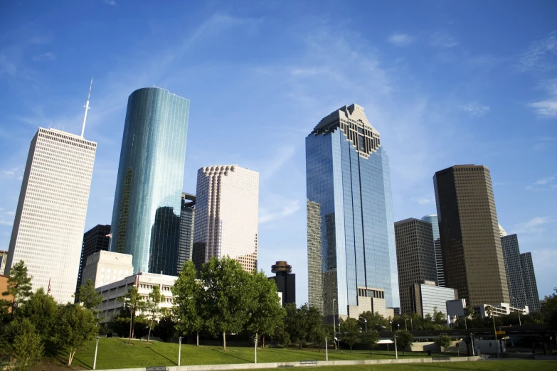 the city skyline is covered with many tall skyscrs