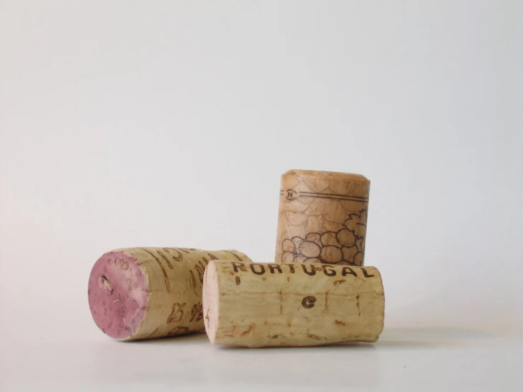 two wine corks sit on the counter for display