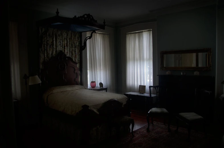 a room with an ornate four poster bed