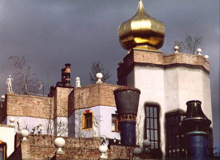 a group of small white buildings with an overhang on top