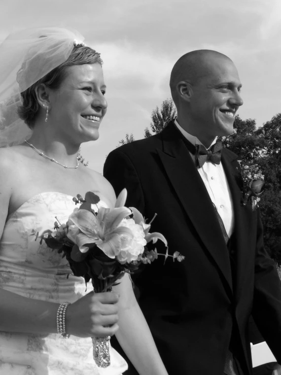 a couple on their wedding day standing near each other