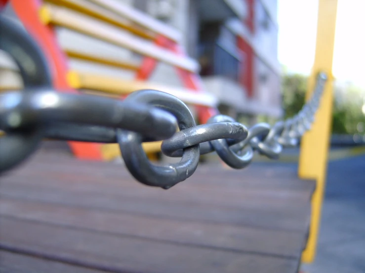 chains hang from a large metal piece