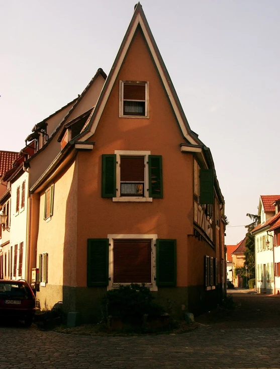 a building in the background with a brick street