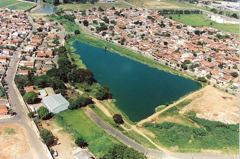 an aerial view of the village, the lake and the surrounding town