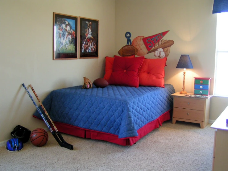 a room with a bed, a tennis racquet and balls