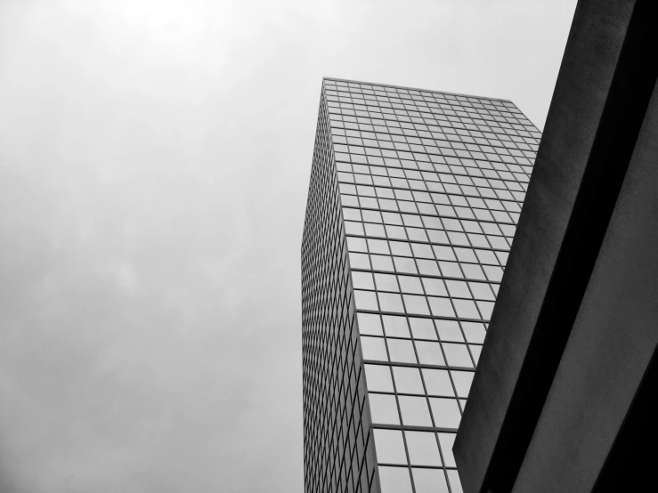 a tall building is next to a traffic sign