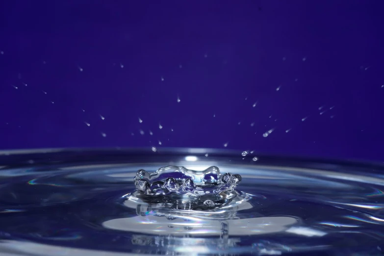 the surface of water has bubbles and is purple