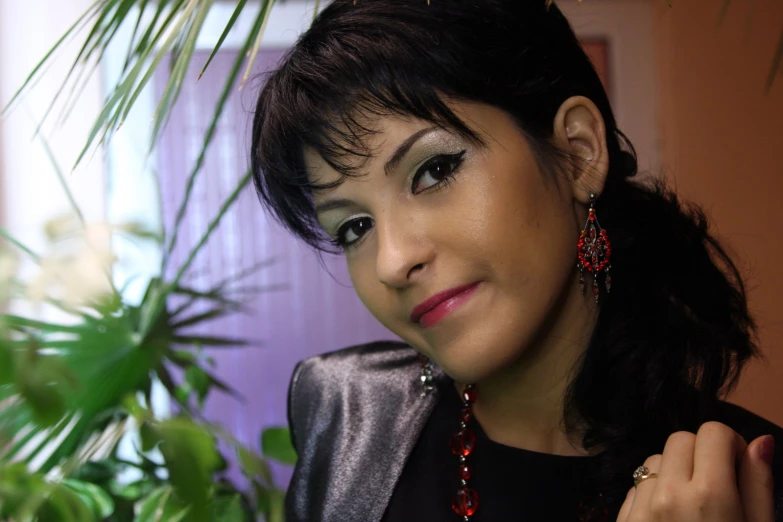 a close up of a woman near some plants