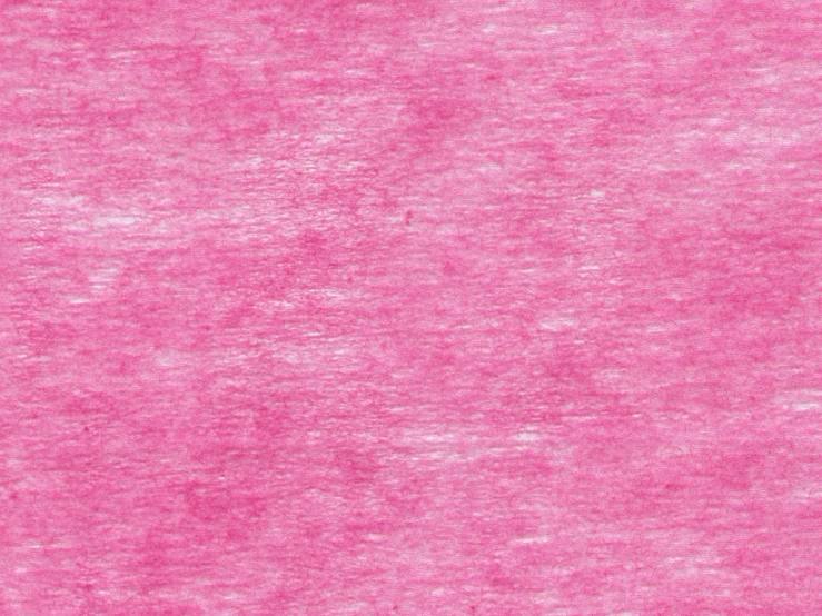 an old pink carpet is shown with some small spots