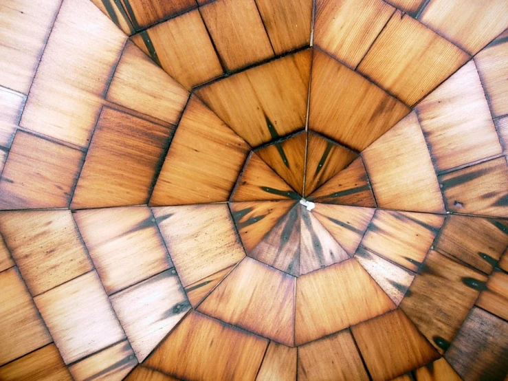 a view of a ceiling in a wood structure