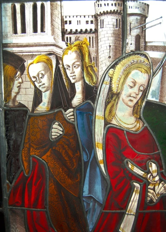 a stained glass window featuring a scene in a medieval era