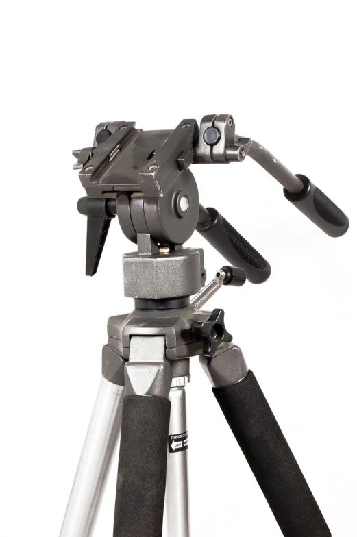 a camera tripod with a phone attached to it