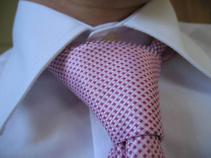 a man is wearing a shirt and tie