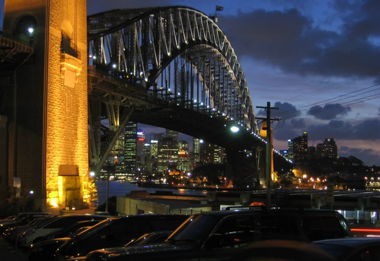 a bridge that is over the water with a lot of cars