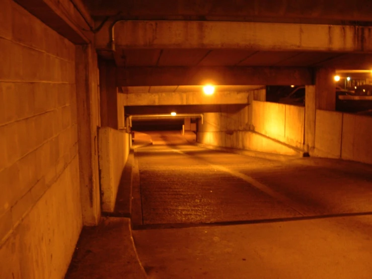 empty parking garage area during nighttime time with no one around