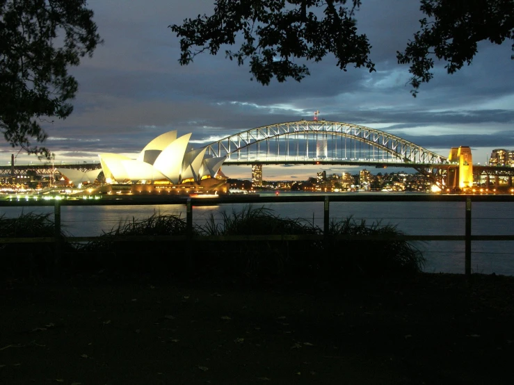 some lights that are on by some water