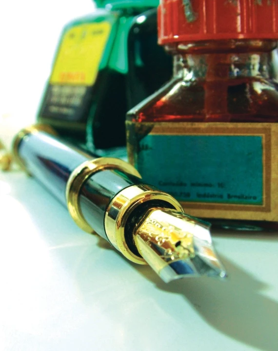 a fountain pen with it's cap on the desk