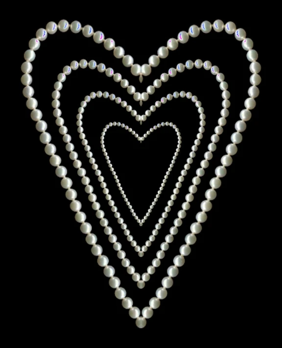 some pearls on some string in the shape of a heart