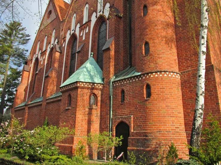 a large brick building with a clock at the top