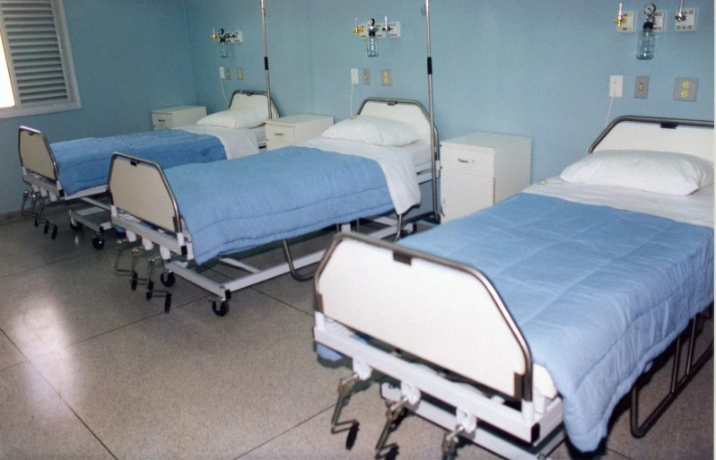 four beds are empty in a hospital like setting