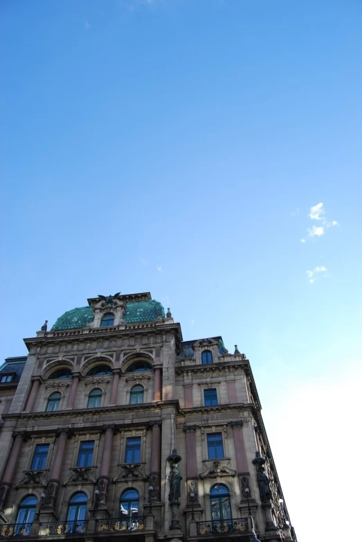 tall building with windows and a blue sky above