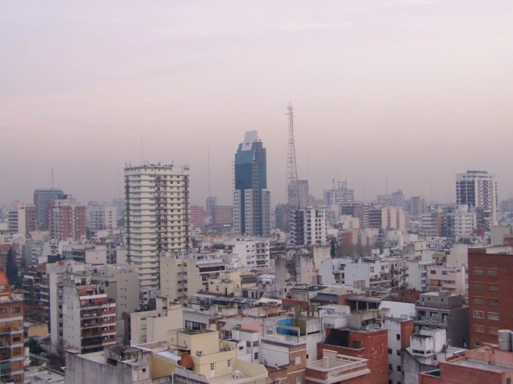 tall buildings are seen from a large roof