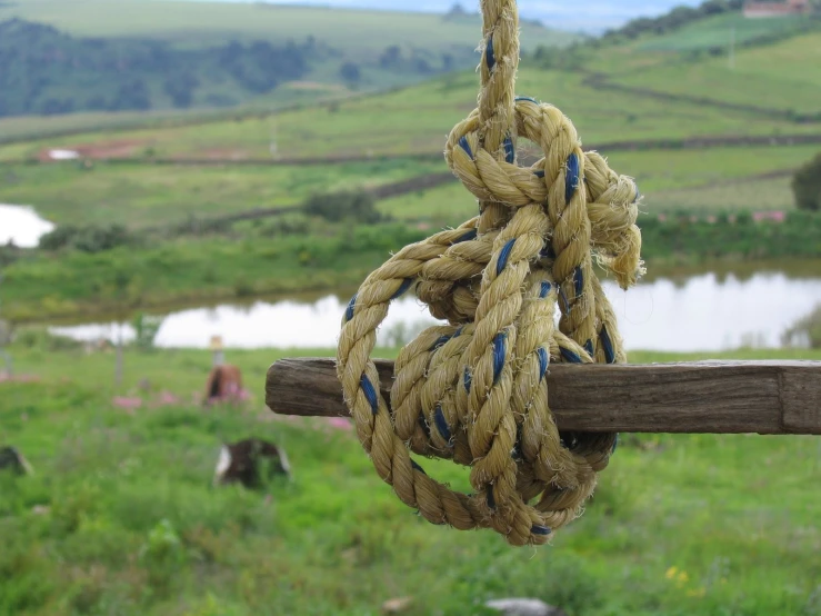 the rope on the wooden pole is knotted together