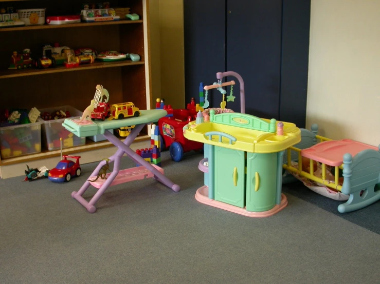 play area with toys and a play train in it