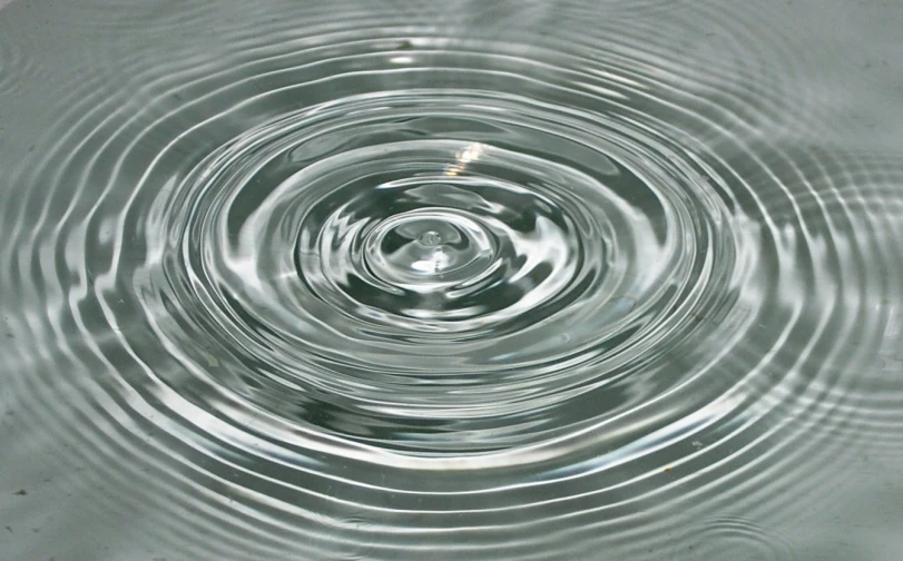 the underside of a metal bowl filled with water