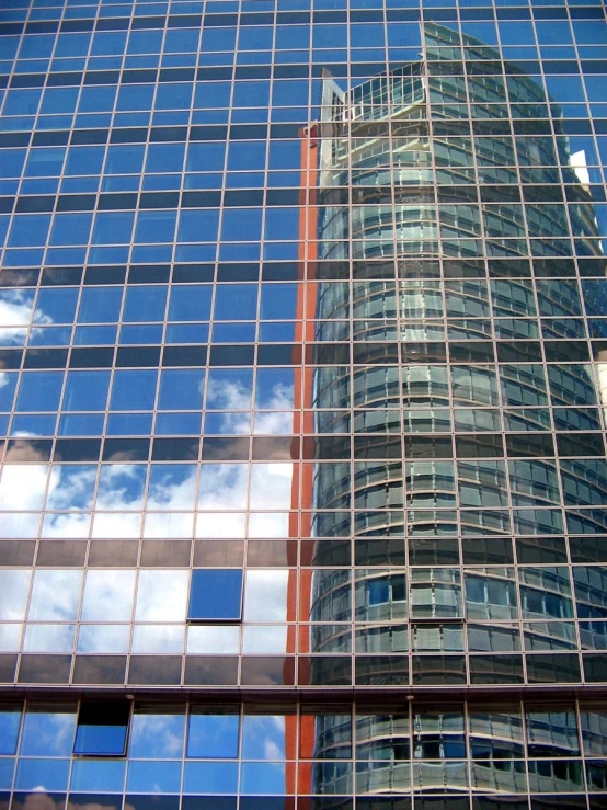 the skyscrs reflecting off the surface of windows