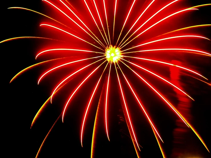 a firework with red and yellow color