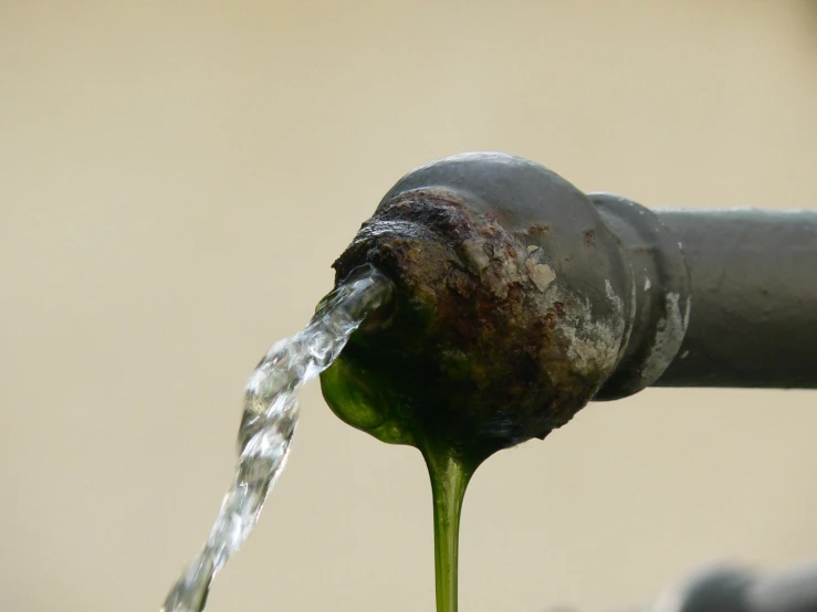 there is water coming from a water spout