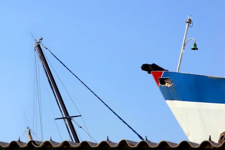 the mast of a large boat with no sails