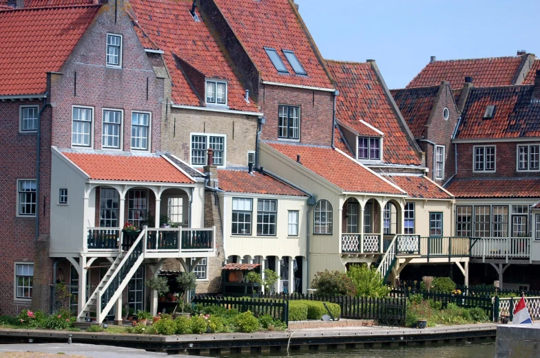 buildings in the countryside are surrounded by waterway and boat