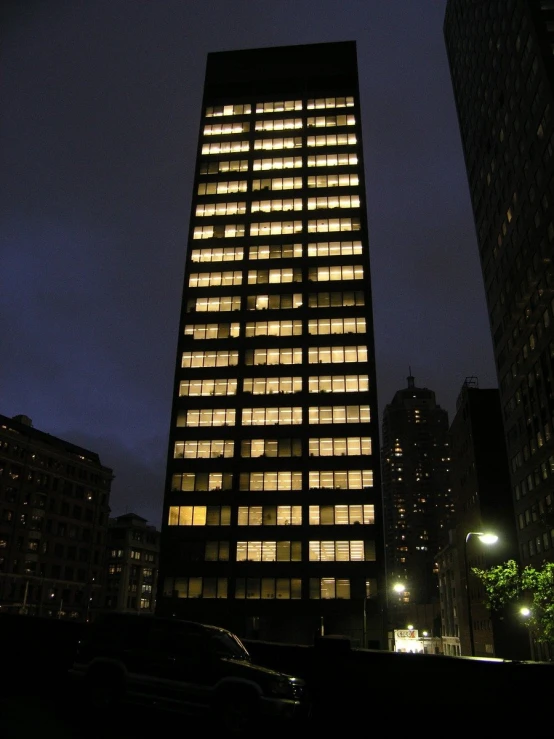 an office building with windows lit up at night