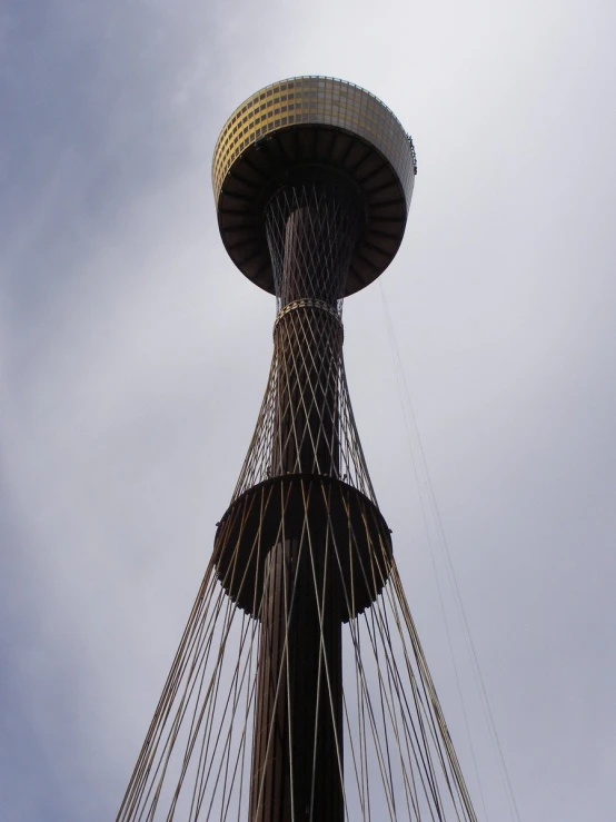 an old fashioned looking sail ship mast with the top section extended